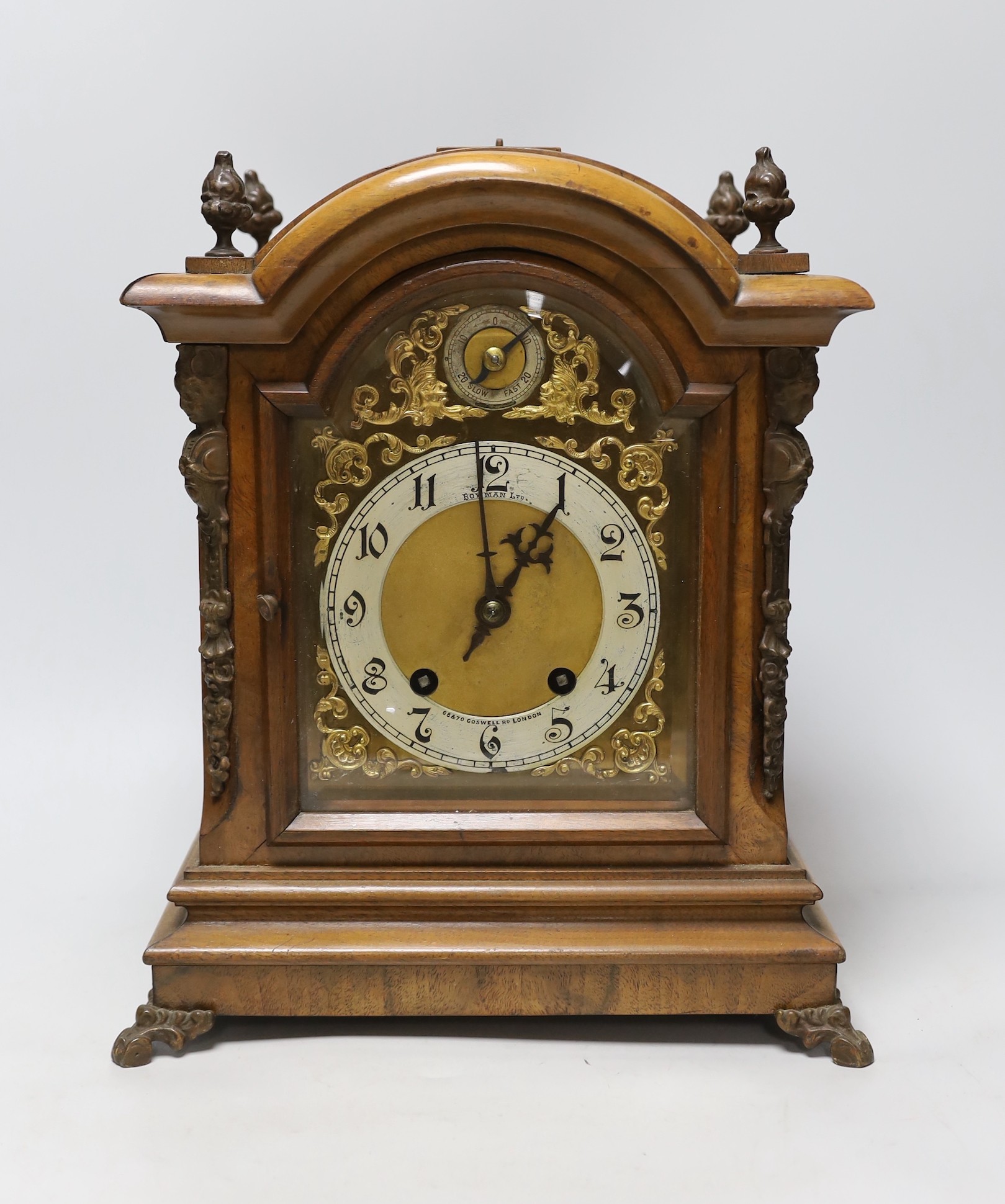 A walnut ting tang mantel clock, 34cms high